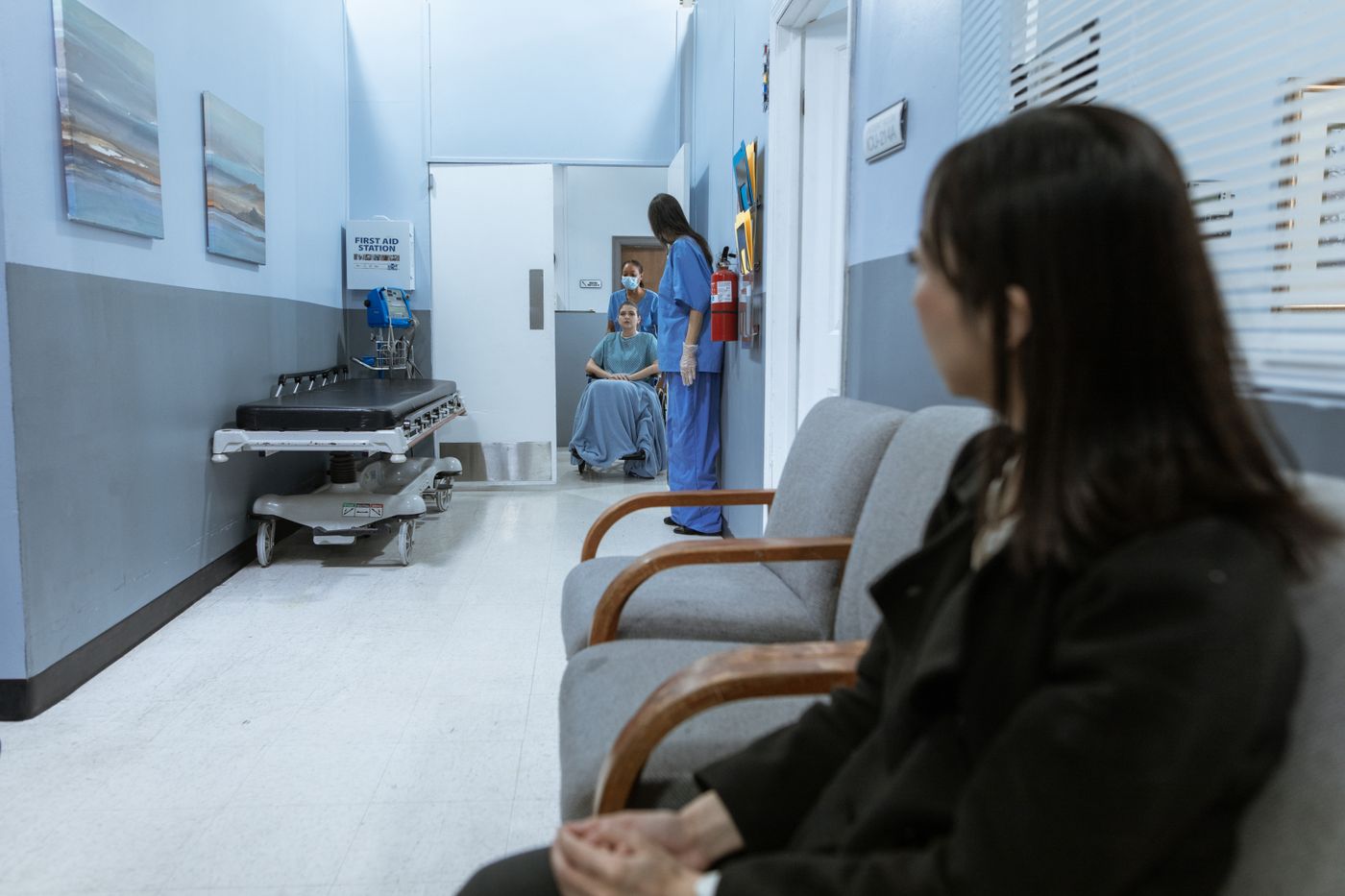 A patient waiting in a clinic corridor